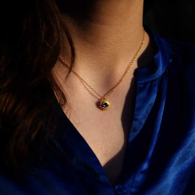 BLUE FEVERFEW PENDANT WORN ON MODEL