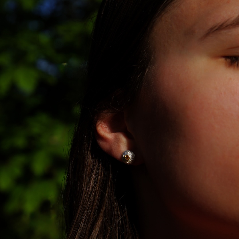 dandelion inspired earrings on model