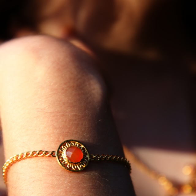 orange marigold bracelet worn